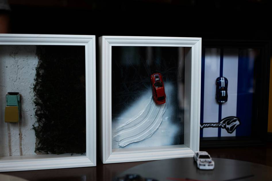 Cozy workspace with shadow box crafting tools and finished elegant frames